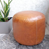 Puff Circular 100% cuero Willy Vintage, base en gamuza, medidas 45 x 35 cms.